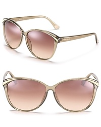 Retro-inspired cat eye sunglasses with contrast winged detail. Retro-inspired cat eye sunglasses with contrast winged detail.