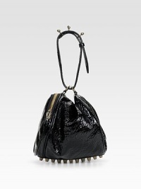 High shine patent leather with a pebbled finish, in a slouchy pouchette shape, adorned with stand-out studs on the circular handle and at the base.Circular handle, about 7 drop Side zip closure Rows of metal feet Fully lined 10W X 7H X 7½D Imported High shine patent leather with a pebbled finish, in a slouchy pouchette shape, adorned with stand-out studs on the circular handle and at the base.Circular handle, about 7 drop Side zip closure Rows of metal feet Fully lined 10W X 7H X 7½D Imported