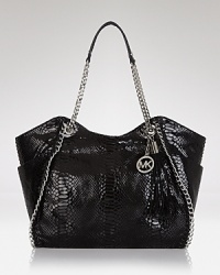 A haute bohemian tote from MICHAEL Michael Kors with gleaming hardware and decorative tassel detail in goes-with-everthing python leather. A haute bohemian tote from MICHAEL Michael Kors with gleaming hardware and decorative tassel detail in goes-with-everthing python leather.