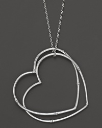 Two bamboo hearts, in sterling silver, make a sweet statement on a chain. Two bamboo hearts, in sterling silver, make a sweet statement on a chain.