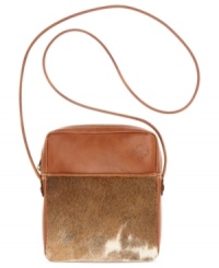 Take on the season's top trend with this haircalf design from Patricia Nash. Rich tan leather, hand-crafted stitching and antiqued brass hardware lend a luxe southwest appeal, while the convenient crossbody strap offers effortless versatility. Take on the season's top trend with this haircalf design from Patricia Nash. Rich tan leather, hand-crafted stitching and antiqued brass hardware lend a luxe southwest appeal, while the convenient crossbody strap offers effortless versatility.
