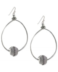 Well-rounded fashion from Jessica Simpson. These oval hoop earrings showcase round crystal accents. Crafted in antiqued worn silver tone mixed metal. Approximate drop: 2-1/2 inches. Well-rounded fashion from Jessica Simpson. These oval hoop earrings showcase round crystal accents. Crafted in antiqued worn silver tone mixed metal. Approximate drop: 2-1/2 inches.