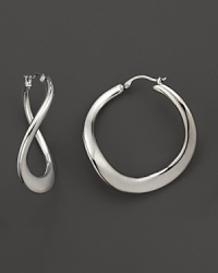 A twist on the classic hoop, these 14K. white gold earrings are luxe and modern. A twist on the classic hoop, these 14K. white gold earrings are luxe and modern.