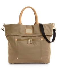Ready for your next impromptu getaway, this travel-ready tote from Calvin Klein stores all your necessities in oh-so chic style. Polished goldtone hardware and a sleek signature plaque add head turning appeal to this adventure seeking design. Ready for your next impromptu getaway, this travel-ready tote from Calvin Klein stores all your necessities in oh-so chic style. Polished goldtone hardware and a sleek signature plaque add head turning appeal to this adventure seeking design.