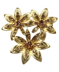 An alluring bouquet from Jones New York. This golden pin in a three-flower design beams with topaz hues. Finished with glass accents. Crafted in gold tone mixed metal. Approximate length: 2 inches. Includes gift box. An alluring bouquet from Jones New York. This golden pin in a three-flower design beams with topaz hues. Finished with glass accents. Crafted in gold tone mixed metal. Approximate length: 2 inches. Includes gift box.