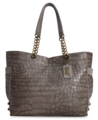 Escape from ordinary accessorizing with this chic carryall from Carlos by Carolos Santana that features a croc-embossed pattern, edgy stud accents and chain-link details. Escape from ordinary accessorizing with this chic carryall from Carlos by Carolos Santana that features a croc-embossed pattern, edgy stud accents and chain-link details.