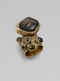 Held in an intriguing freeform setting, a stone of beautiful glass is suspended above your finger.GlassAntique-inspired goldtoneWidth, about 1.1Made in Italy Held in an intriguing freeform setting, a stone of beautiful glass is suspended above your finger.GlassAntique-inspired goldtoneWidth, about 1.1Made in Italy