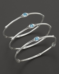 From the Batu Bamboo collection, a set of three slim bamboo bangles with blue topaz accents. Designed by John Hardy From the Batu Bamboo collection, a set of three slim bamboo bangles with blue topaz accents. Designed by John Hardy