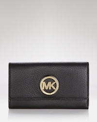 This effortless wallet captures the cosmopolitan essence of MICHAEL Michael Kors with its slim profile and sophisticated leather. This effortless wallet captures the cosmopolitan essence of MICHAEL Michael Kors with its slim profile and sophisticated leather.