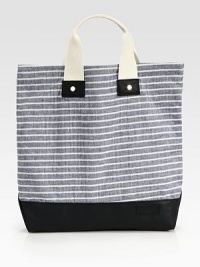 Canvas pairs with rich leather in this roomy top-handle carryall. Cotton double top handles, 3½ dropOne inside pocketFully lined13W X 15H X 3½DImported Canvas pairs with rich leather in this roomy top-handle carryall. Cotton double top handles, 3½ dropOne inside pocketFully lined13W X 15H X 3½DImported