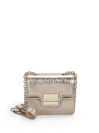 THE LOOKGolden chain and leather strapMagnetic tab-and-loop flap closureFront golden logo buckleInside logo detailTHE MEASUREMENTCrossbody chain, 24 drop6½W X 5½H X 2½DTHE MATERIALMetallic leatherFully linedORIGINImported THE LOOKGolden chain and leather strapMagnetic tab-and-loop flap closureFront golden logo buckleInside logo detailTHE MEASUREMENTCrossbody chain, 24 drop6½W X 5½H X 2½DTHE MATERIALMetallic leatherFully linedORIGINImported