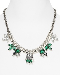 Crafted from silver plated metal with spiked crystal accents, this Aqua statement necklace works an edgy vibe while maintaining a refined allure. Crafted from silver plated metal with spiked crystal accents, this Aqua statement necklace works an edgy vibe while maintaining a refined allure.