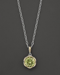 Diamonds, set in sterling silver and 18K yellow gold, frame a faceted round of lemon quartz. By Tacori. Diamonds, set in sterling silver and 18K yellow gold, frame a faceted round of lemon quartz. By Tacori.