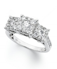 With its polished setting, and stunning three-stone design, this engagement ring is sure to get her attention. Band crafted in 14k white gold with dozens of round-cut diamonds (1-1/2 ct. t.w.) in the center and at the shoulders. With its polished setting, and stunning three-stone design, this engagement ring is sure to get her attention. Band crafted in 14k white gold with dozens of round-cut diamonds (1-1/2 ct. t.w.) in the center and at the shoulders.