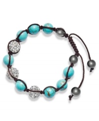 Spiritual-inspired bracelets are all the rage this season! Snap up this hot style from Ali Khan featuring semi-precious turquoise beads and pave glass fireballs on a trendy black cord. Bracelet adjusts to fit the wrist. Approximate diameter: 2 inches. Approximate length: 12-1/4 inches. Spiritual-inspired bracelets are all the rage this season! Snap up this hot style from Ali Khan featuring semi-precious turquoise beads and pave glass fireballs on a trendy black cord. Bracelet adjusts to fit the wrist. Approximate diameter: 2 inches. Approximate length: 12-1/4 inches.