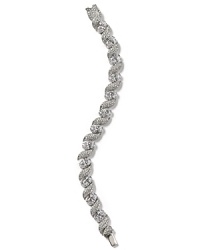 Feather your jewelry box with this rhodium-plated bangle from Lora Paolo. It features delicate feather-shaped stations and inset crystals for a bohemian take on luxury. Feather your jewelry box with this rhodium-plated bangle from Lora Paolo. It features delicate feather-shaped stations and inset crystals for a bohemian take on luxury.
