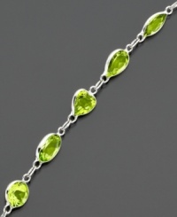 Shape your look with glowing green peridot (6-9/10 ct. t.w.). Bracelet features round, heart and oval cuts set in 14k white gold. Approximate length: 7 inches. Shape your look with glowing green peridot (6-9/10 ct. t.w.). Bracelet features round, heart and oval cuts set in 14k white gold. Approximate length: 7 inches.