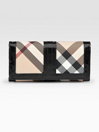 A sleek continental silhouette crafted from signature check PVC and rich leather trim.Snap button closureFive open pocketsOne zip pocketFifteen credit card slotsNylon lining7½W X 3½H X 1/2DMade in Italy A sleek continental silhouette crafted from signature check PVC and rich leather trim.Snap button closureFive open pocketsOne zip pocketFifteen credit card slotsNylon lining7½W X 3½H X 1/2DMade in Italy