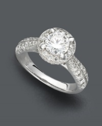 A lustrous circle of sparkle. X3's stunning engagement ring features a round-cut, certified diamond (1-1/5 ct. t.w.) surrounded by pave-set diamond accents. Set in 18k white gold. A lustrous circle of sparkle. X3's stunning engagement ring features a round-cut, certified diamond (1-1/5 ct. t.w.) surrounded by pave-set diamond accents. Set in 18k white gold.