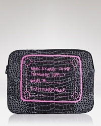 The writing is on this neoprene MARC BY MARC JACOBS computer case, cleverly constructed to carry your computer while it flaunts your cool-girl credentials. The writing is on this neoprene MARC BY MARC JACOBS computer case, cleverly constructed to carry your computer while it flaunts your cool-girl credentials.