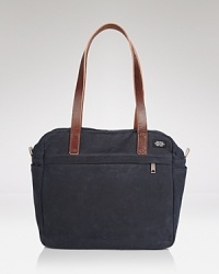 Classic navy canvas gets a handsome lift with smooth leather straps on this versatile Jade Spade tote. Classic navy canvas gets a handsome lift with smooth leather straps on this versatile Jade Spade tote.