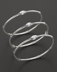 From the Batu Bamboo collection, a set of three slim bamboo bangles with white topaz accents. Designed by John Hardy. From the Batu Bamboo collection, a set of three slim bamboo bangles with white topaz accents. Designed by John Hardy.