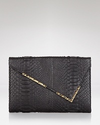 Be & D perfects night-right accessorizing with this embossed leather clutch. Tuck it under your arm to snake, rattle, and roll. Be & D perfects night-right accessorizing with this embossed leather clutch. Tuck it under your arm to snake, rattle, and roll.