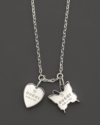 Embossed heart and butterfly charms dangle from an 18L sterling silver chain. From Gucci's Trademark collection. Embossed heart and butterfly charms dangle from an 18L sterling silver chain. From Gucci's Trademark collection.
