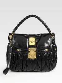 Sleek leather design finished with a braided top handle and polished hardware. Braided top handle, 4 drop Detachable crossbody strap, 20 drop Lock closure Two outside snap pockets One inside zip pocket Satin lining 14½W X 12½H X 2D Made in Italy Sleek leather design finished with a braided top handle and polished hardware. Braided top handle, 4 drop Detachable crossbody strap, 20 drop Lock closure Two outside snap pockets One inside zip pocket Satin lining 14½W X 12½H X 2D Made in Italy