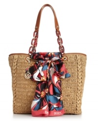 All dressed up and ready to go. This casual straw shopper is adorably adorned in a floral printed scarf and and shiny gold-tone hardware. All dressed up and ready to go. This casual straw shopper is adorably adorned in a floral printed scarf and and shiny gold-tone hardware.