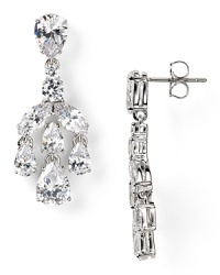 A dramatic crystal cascade illuminates this pair of Nadri chandelier earrings, which flaunts an elegant allure, set off by rhodium plated metal. A dramatic crystal cascade illuminates this pair of Nadri chandelier earrings, which flaunts an elegant allure, set off by rhodium plated metal.