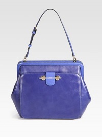 Luxurious leather with beautiful saffiano leather accents in a roomy carryall design.Adjustable shoulder strap, 7½-8¾ dropTop zip closureOne outside open pocket with flap closureOne inside zip pocketTwo inside open pocketsSilk blend lining9½W X 11½H X 4DMade in Italy Luxurious leather with beautiful saffiano leather accents in a roomy carryall design.Adjustable shoulder strap, 7½-8¾ dropTop zip closureOne outside open pocket with flap closureOne inside zip pocketTwo inside open pocketsSilk blend lining9½W X 11½H X 4DMade in Italy