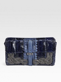 A stunning style in bold, two-tone cobra skin accented with beautiful knot motifs.Magnetic top closureTwo outside snap strap flap pocketsSuede lining12W X 6H X 1¼DMade in Italy A stunning style in bold, two-tone cobra skin accented with beautiful knot motifs.Magnetic top closureTwo outside snap strap flap pocketsSuede lining12W X 6H X 1¼DMade in Italy