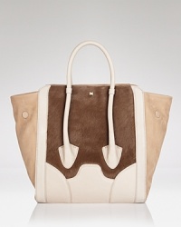 Textured calf hair details this Pour La Victoire tote, taking a classic shape into wild territory. Leather trims lend a luxurious feel, while double handles and a spacious shape add to its citified ease. Textured calf hair details this Pour La Victoire tote, taking a classic shape into wild territory. Leather trims lend a luxurious feel, while double handles and a spacious shape add to its citified ease.