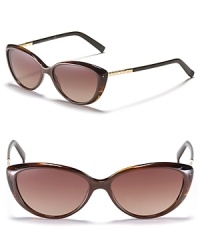 Small retro-inspired cat eye sunglasses with textured metal temples for a modern twist. Small retro-inspired cat eye sunglasses with textured metal temples for a modern twist.