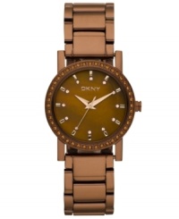 A chocolate dream, by DKNY. Watch crafted of brown ion-plated stainless steel bracelet and round case. Bezel embellished with 48 rose tone crystal accents. Brown dial features 12 rose tone crystal dot markers, rose-gold tone three hands, minute track and logo at twelve o'clock. Quartz movement. Water resistant to 50 meters. Two-year limited warranty. A chocolate dream, by DKNY. Watch crafted of brown ion-plated stainless steel bracelet and round case. Bezel embellished with 48 rose tone crystal accents. Brown dial features 12 rose tone crystal dot markers, rose-gold tone three hands, minute track and logo at twelve o'clock. Quartz movement. Water resistant to 50 meters. Two-year limited warranty.