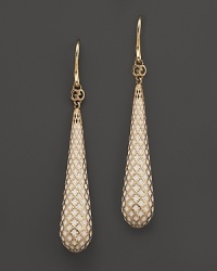 An intricate lattice design in 18K yellow gold is hand-detailed with enamel on Gucci's Diamantissima earrings. An intricate lattice design in 18K yellow gold is hand-detailed with enamel on Gucci's Diamantissima earrings.