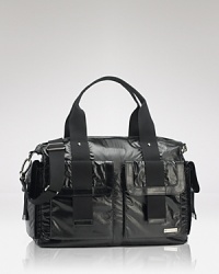 Shiny and chic, this duffle bag hides a practical secret: it's packed with on-the-go essentials for stylish mamas. By storsak. Shiny and chic, this duffle bag hides a practical secret: it's packed with on-the-go essentials for stylish mamas. By storsak.