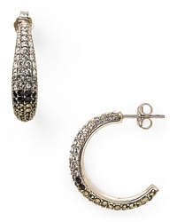 Judith Jack styles sweet simplicity with this pair of graduated hoop earrings, set in sterling silver and accented by mesmerizing tonal crystals. Judith Jack styles sweet simplicity with this pair of graduated hoop earrings, set in sterling silver and accented by mesmerizing tonal crystals.