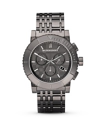 This triple chronograph watch, featuring a gunmetal sunray dial and steel check-inspired bracelet, is a Burberry classic in the making. This triple chronograph watch, featuring a gunmetal sunray dial and steel check-inspired bracelet, is a Burberry classic in the making.