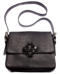 Luxe and lovely, this diva-licious design from Juicy Couture gives any outfit an uptown look. Supple leather is accented with an eye-catching stone accent, while plenty of interior compartments organize your essentials with ease. Luxe and lovely, this diva-licious design from Juicy Couture gives any outfit an uptown look. Supple leather is accented with an eye-catching stone accent, while plenty of interior compartments organize your essentials with ease.