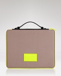 Get your iPad case on point. This neoprene sleeve from MARC BY MARC JACOBS flaunts a streamlined design with the added on-the-go ease of a top handle. Get your iPad case on point. This neoprene sleeve from MARC BY MARC JACOBS flaunts a streamlined design with the added on-the-go ease of a top handle.