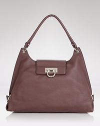 Salvatore Ferragamo gives its sought after hobo a polished update. In pebbled leather with silver tone detailing, this carryall will punctuate every pulled together look. Salvatore Ferragamo gives its sought after hobo a polished update. In pebbled leather with silver tone detailing, this carryall will punctuate every pulled together look.