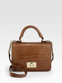 A chic boxy frame in luxurious patent crocodile embossed leather.Top handle, 4½ dropDetachable adjustable chain and patent crocodile embossed leather shoulder strap, 20-22½ dropTurnlock flap closureOne inside zip pocketTwo inside open pocketsFully lined9½W X 7H X 3½DImported A chic boxy frame in luxurious patent crocodile embossed leather.Top handle, 4½ dropDetachable adjustable chain and patent crocodile embossed leather shoulder strap, 20-22½ dropTurnlock flap closureOne inside zip pocketTwo inside open pocketsFully lined9½W X 7H X 3½DImported