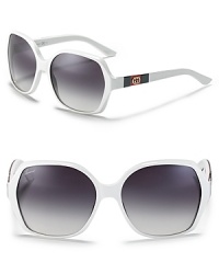Interlocking G logos at temples elevate these oversize Gucci shades to covetable statement accessories. Bold white frames channel style-savvy confidence. Interlocking G logos at temples elevate these oversize Gucci shades to covetable statement accessories. Bold white frames channel style-savvy confidence.