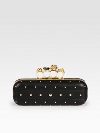 Chic studs on supple nappa leather with a skull accented knuckle duster closure.Knuckle duster top clasp closureLeather lining8¾W X 3H X 1½DMade in Italy Chic studs on supple nappa leather with a skull accented knuckle duster closure.Knuckle duster top clasp closureLeather lining8¾W X 3H X 1½DMade in Italy