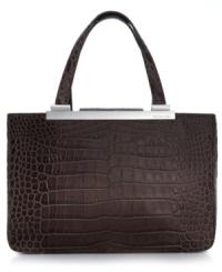 Accentuate your allure for the exotic with this MICHAEL Michael Kors silhouette in croc- or lizard-embossed leather. Gleaming custom hardware complements the classic carryall design that features an ultra-spacious interior. Carry it day or night for added edge to any outfit. Accentuate your allure for the exotic with this MICHAEL Michael Kors silhouette in croc- or lizard-embossed leather. Gleaming custom hardware complements the classic carryall design that features an ultra-spacious interior. Carry it day or night for added edge to any outfit.