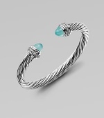 From the Cable Collection. An iconic design with aqua chalcedony caps accented in dazzling diamonds. Aqua chalcedonyDiamonds, .48 tcwSterling silverDiameter, about 2½Slip-on styleImported 