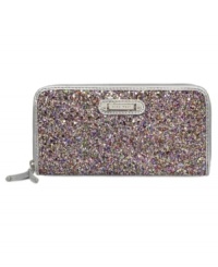 Discover your inner glam-azon with this shimmery little lovely from Nine West. Decked out in candy-colored sequin and signature detailing, its pocket-lined interior stows your stash without a worry. Discover your inner glam-azon with this shimmery little lovely from Nine West. Decked out in candy-colored sequin and signature detailing, its pocket-lined interior stows your stash without a worry.