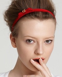 Go for a polished look with the perfect accessory, a thin grosgrain headband featuring Ferragamo's signature bow and logo accent. Go for a polished look with the perfect accessory, a thin grosgrain headband featuring Ferragamo's signature bow and logo accent.